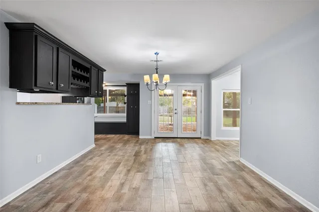 a view of a kitchen with an empty space and a window