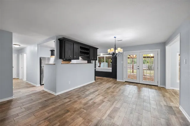 a view of a kitchen with a sink and a refrigerator