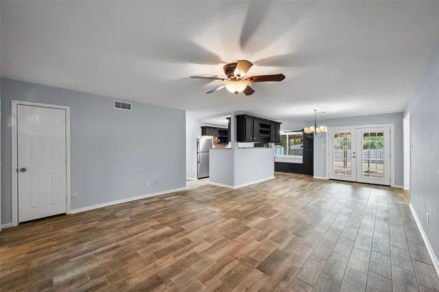 a view of a kitchen with a microwave and a stove top oven