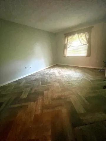 a view of an empty room and window