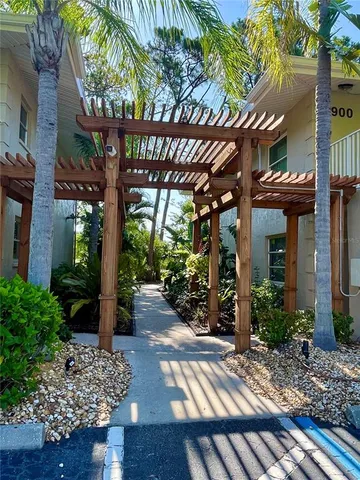 a view of a chairs and table in the patio