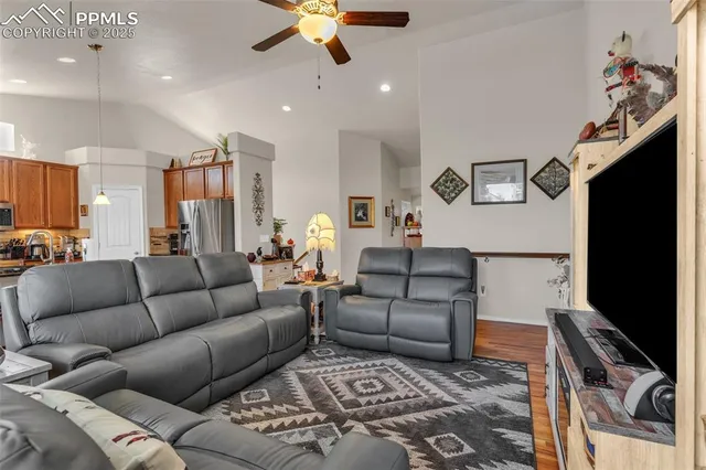 a living room with furniture and a flat screen tv