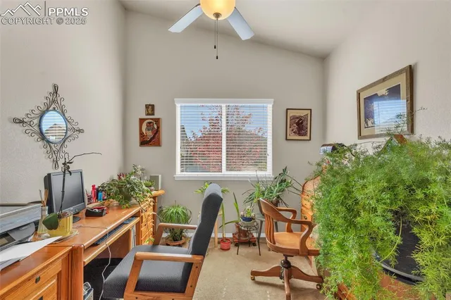 a view of a workspace with furniture