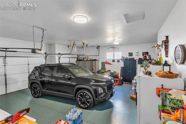 a backyard of a house with barbeque oven table and chairs