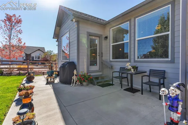 a view of a house with backyard porch and sitting area