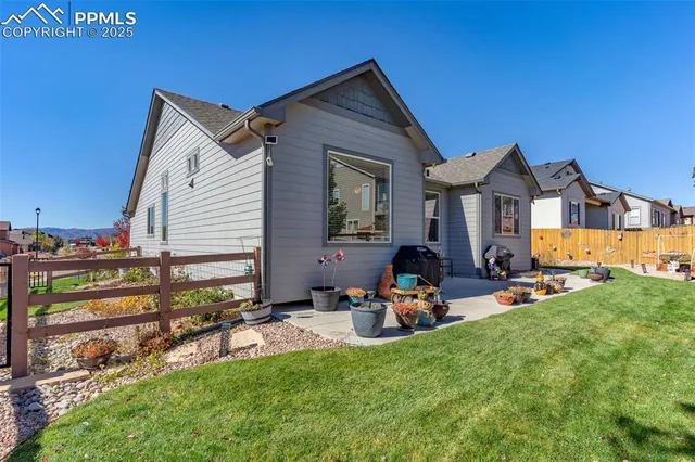 a view of backyard with patio