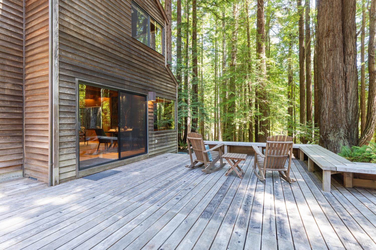 36419 East Ridge Road The Sea Ranch, CA 95497 - Photo 20 of 55 a view of a patio with table and chairs and wooden floor