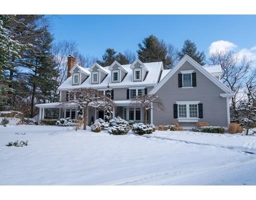 73 Stonecrest Drive Needham, MA 02492 - Photo 1 of 13 a front view of a house with a yard covered with snow