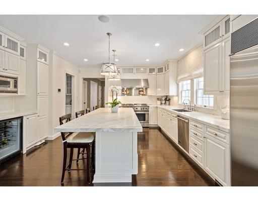73 Stonecrest Drive Needham, MA 02492 - Photo 6 of 13 a kitchen with stainless steel appliances kitchen island granite countertop a kitchen island and a cabinets