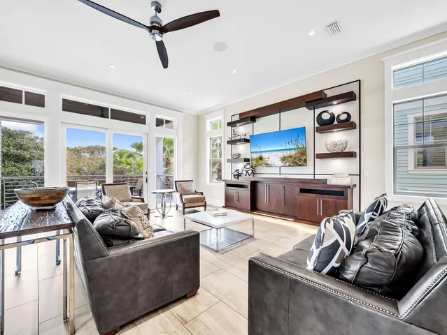 a view of deck with furniture and a garden