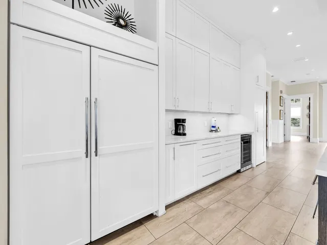 a bathroom with a sink mirror and a bathtub