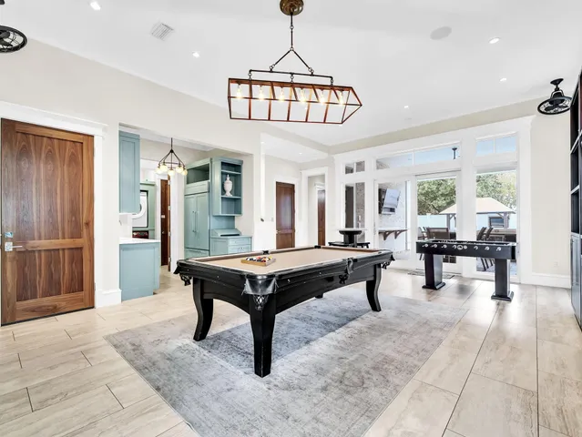 a spacious bathroom with a sink and a mirror