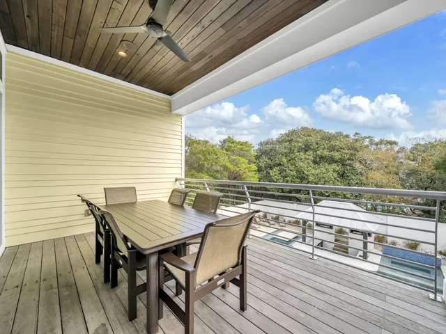 a view of a kitchen with a sink and wooden floor