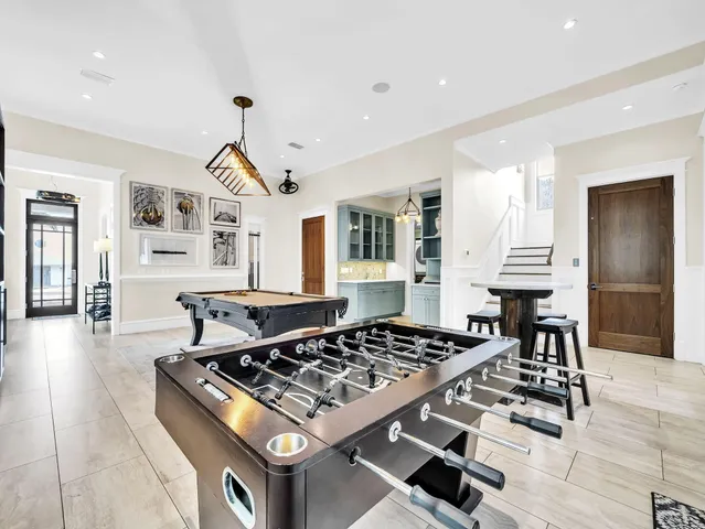 a bathroom with a granite countertop sink mirror vanity and toilet
