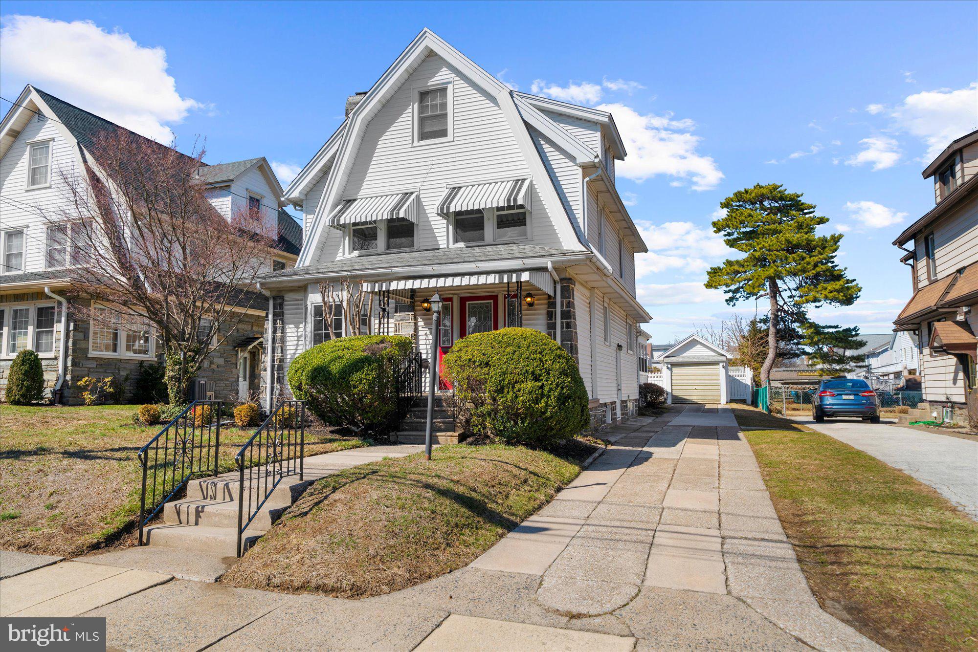 206 North Manoa Road Havertown, PA 19083 - Photo 1 of 50 a view of a white building among the street with outdoor seating