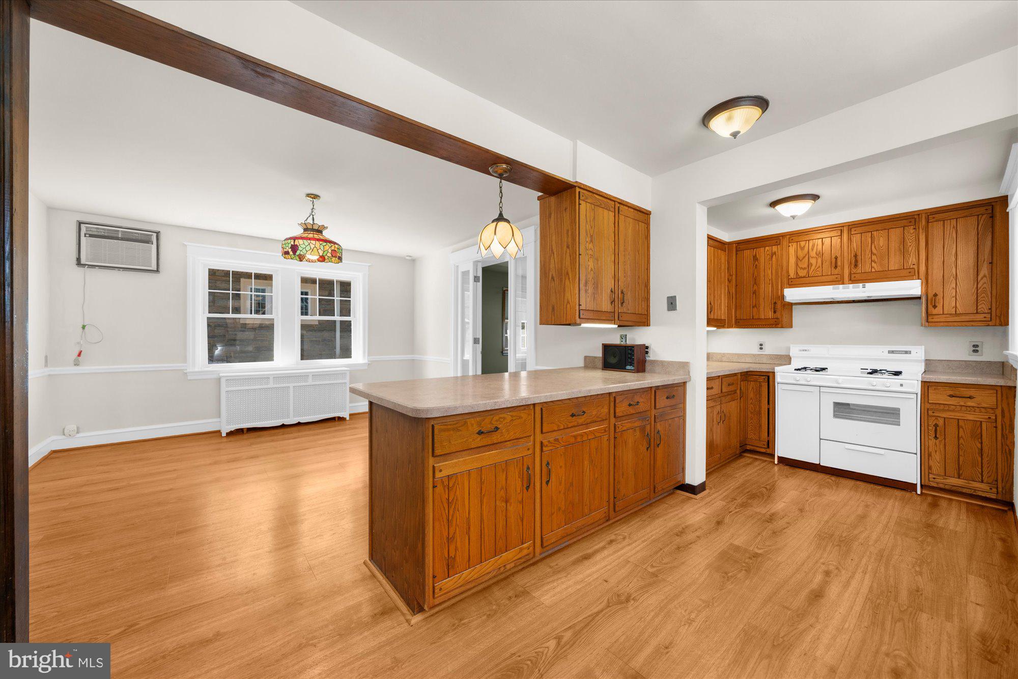 206 North Manoa Road Havertown, PA 19083 - Photo 12 of 50 a kitchen with stainless steel appliances granite countertop a stove a sink dishwasher and a microwave oven with cabinets