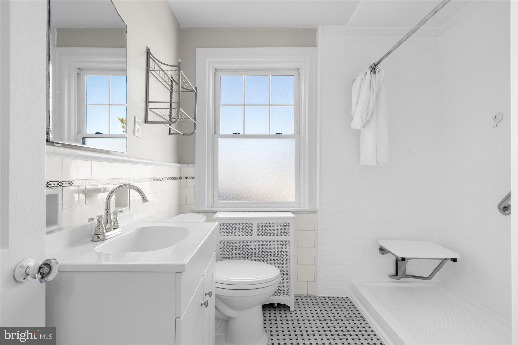 206 North Manoa Road Havertown, PA 19083 - Photo 23 of 50 a bathroom with a toilet a sink and mirror