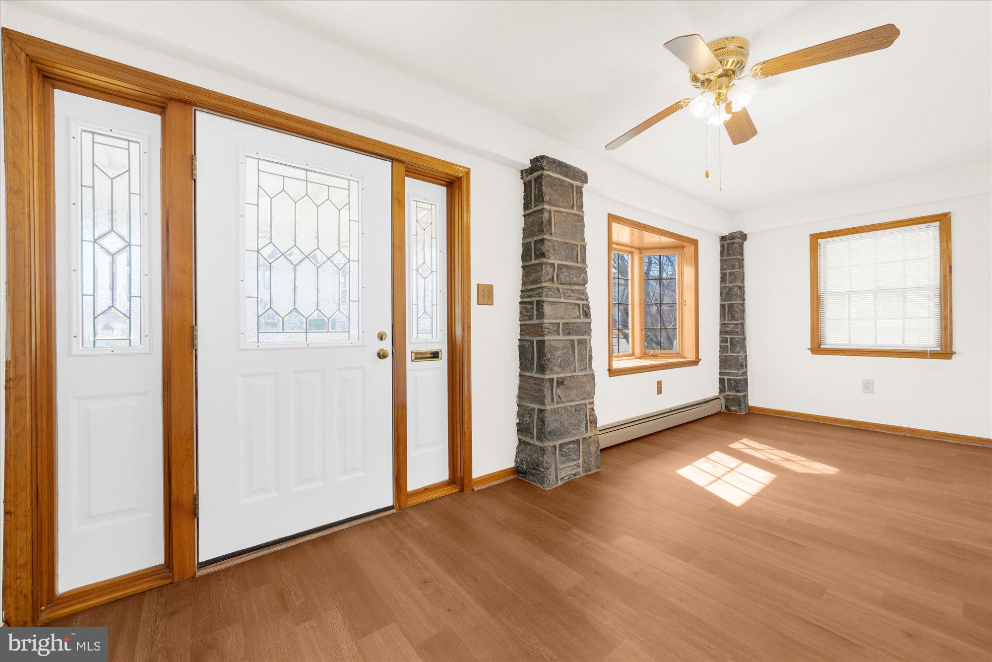 206 North Manoa Road Havertown, PA 19083 - Photo 3 of 50 a view of an empty room with a window and wooden floor