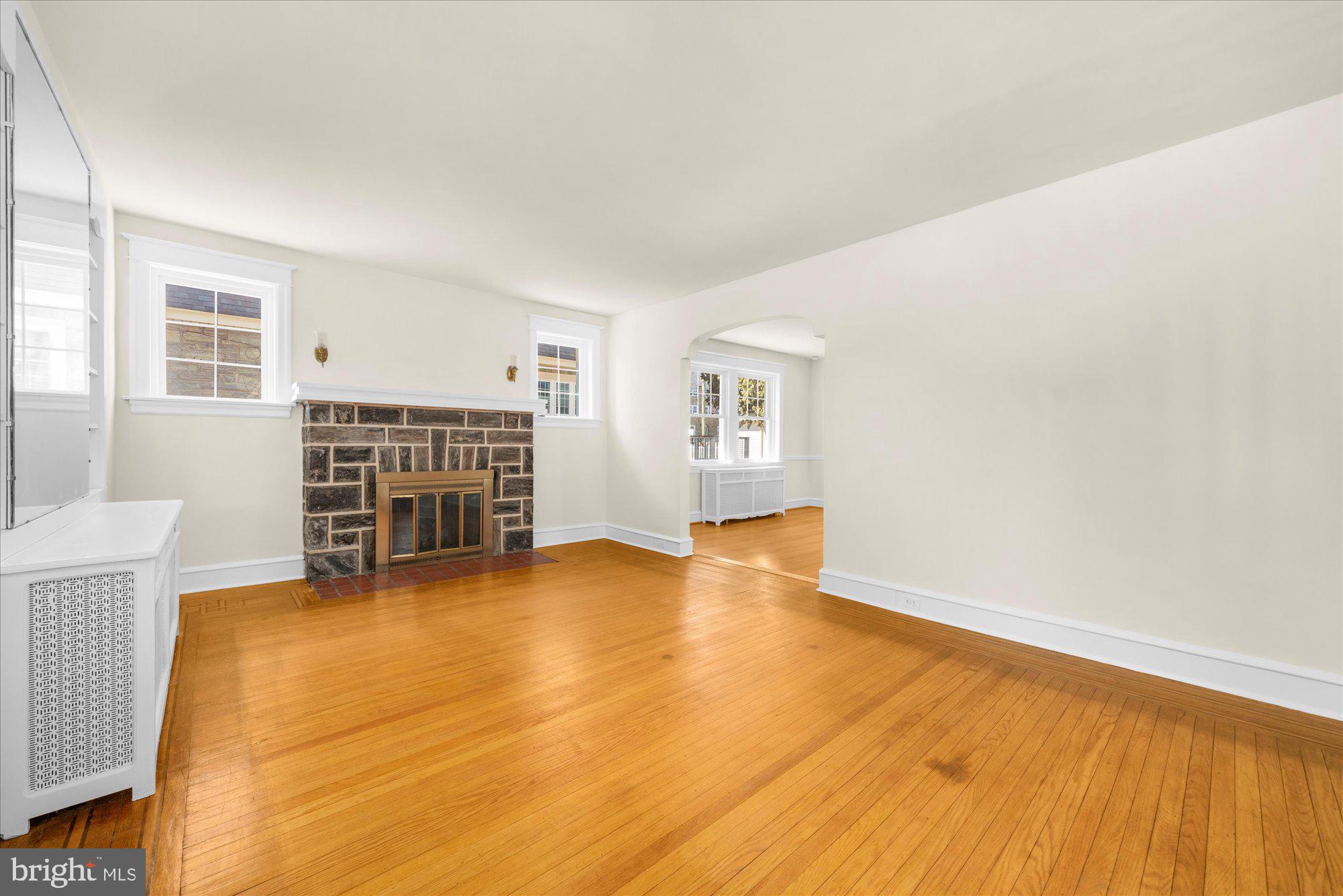 206 North Manoa Road Havertown, PA 19083 - Photo 5 of 50 a view of an empty room with wooden floor and a window