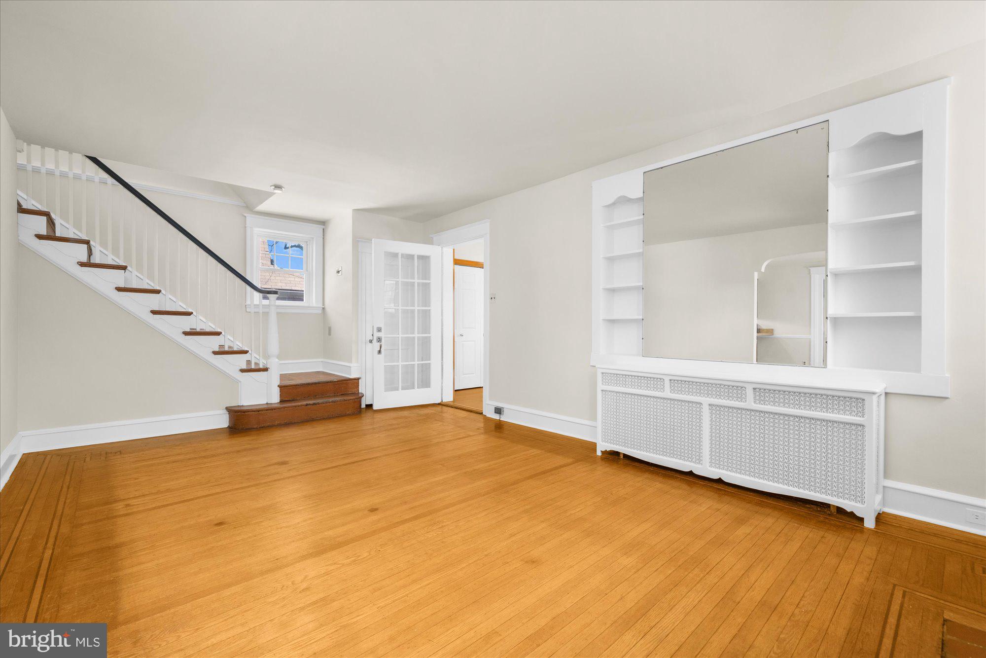 206 North Manoa Road Havertown, PA 19083 - Photo 7 of 50 a view of an empty room with wooden floor and a window