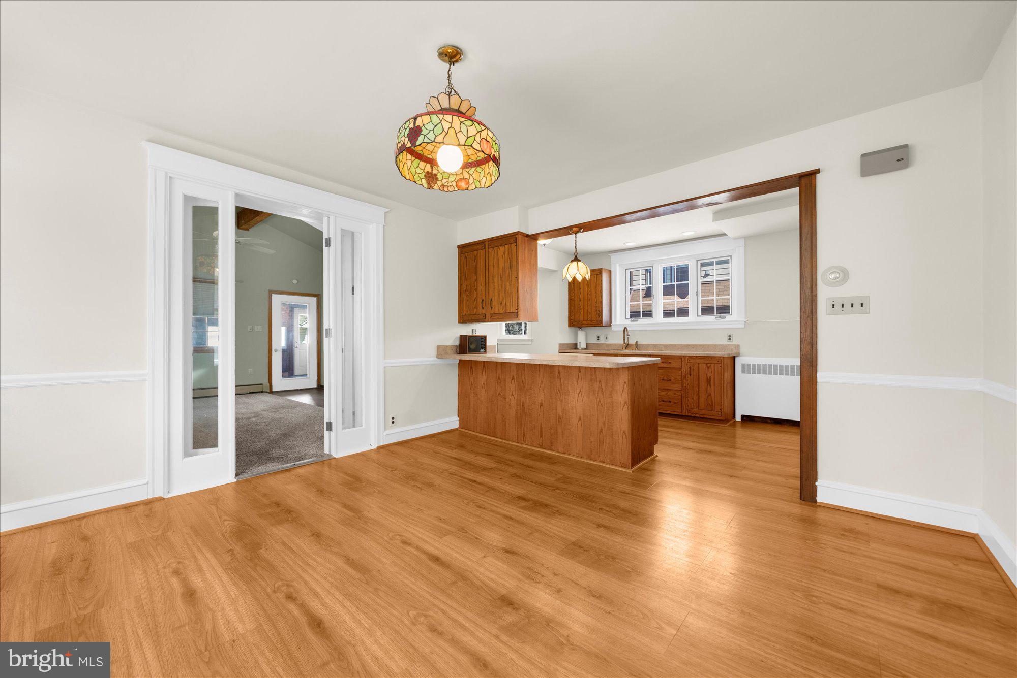 206 North Manoa Road Havertown, PA 19083 - Photo 8 of 50 a view of kitchen with wooden floor and window
