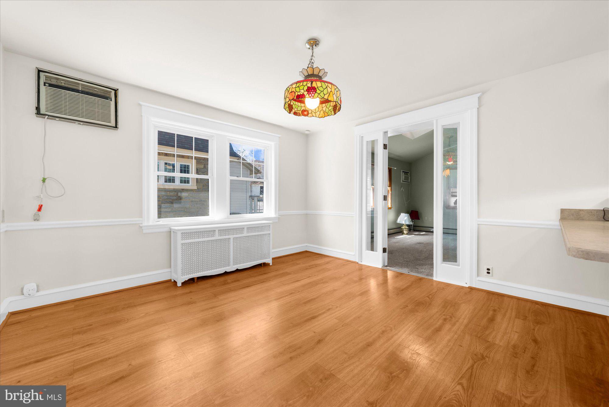 206 North Manoa Road Havertown, PA 19083 - Photo 10 of 50 a view of an empty room with window and wooden floor