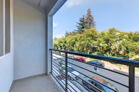 a view of a back yard from a balcony