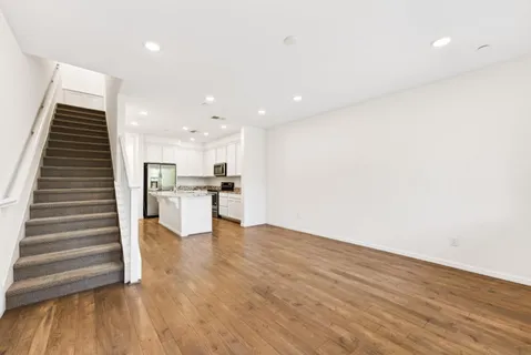a view of kitchen with wooden floor