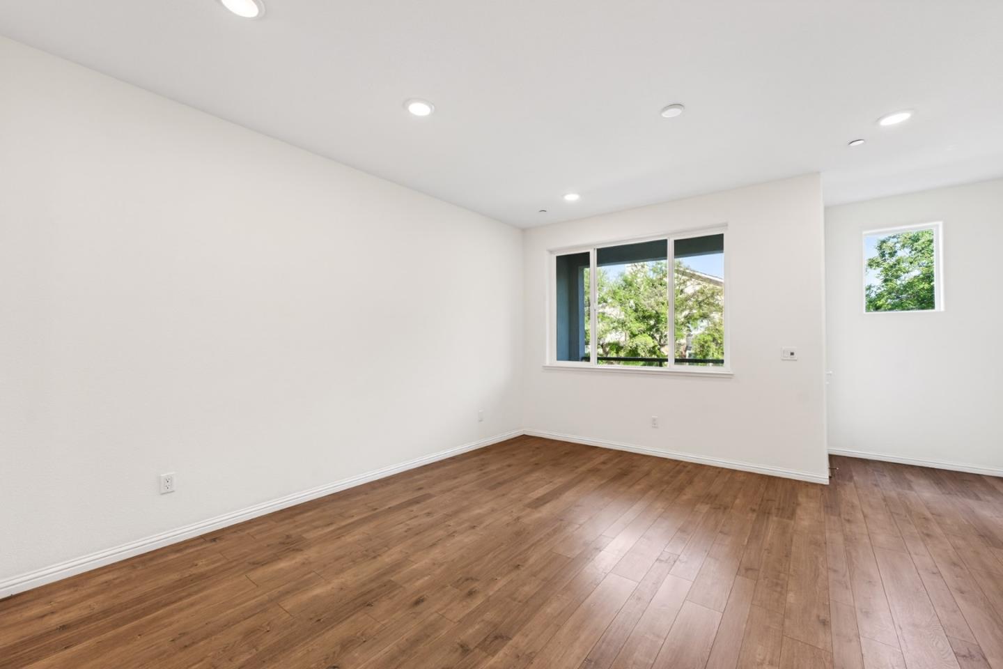 2580 Gimelli Way San Jose, CA 95133 - Photo 6 of 50 an empty room with wooden floor and window