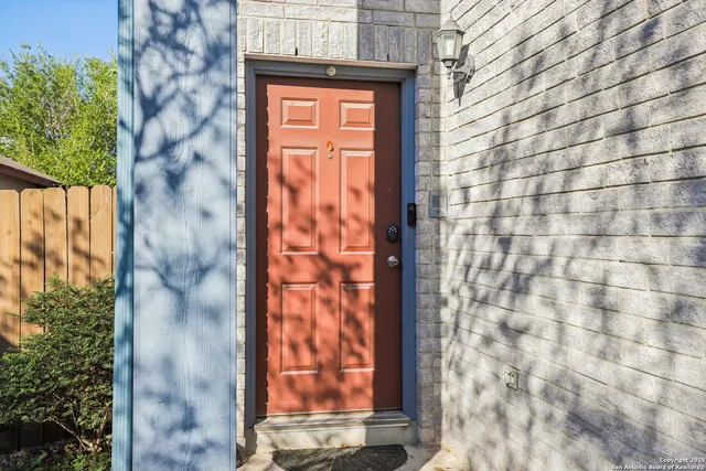 a view of a kitchen with a sink and microwave