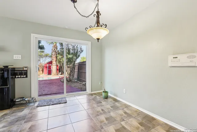 a kitchen with a sink cabinets and appliances