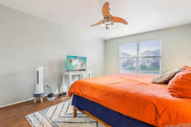 a bed room with a bed and a chandelier