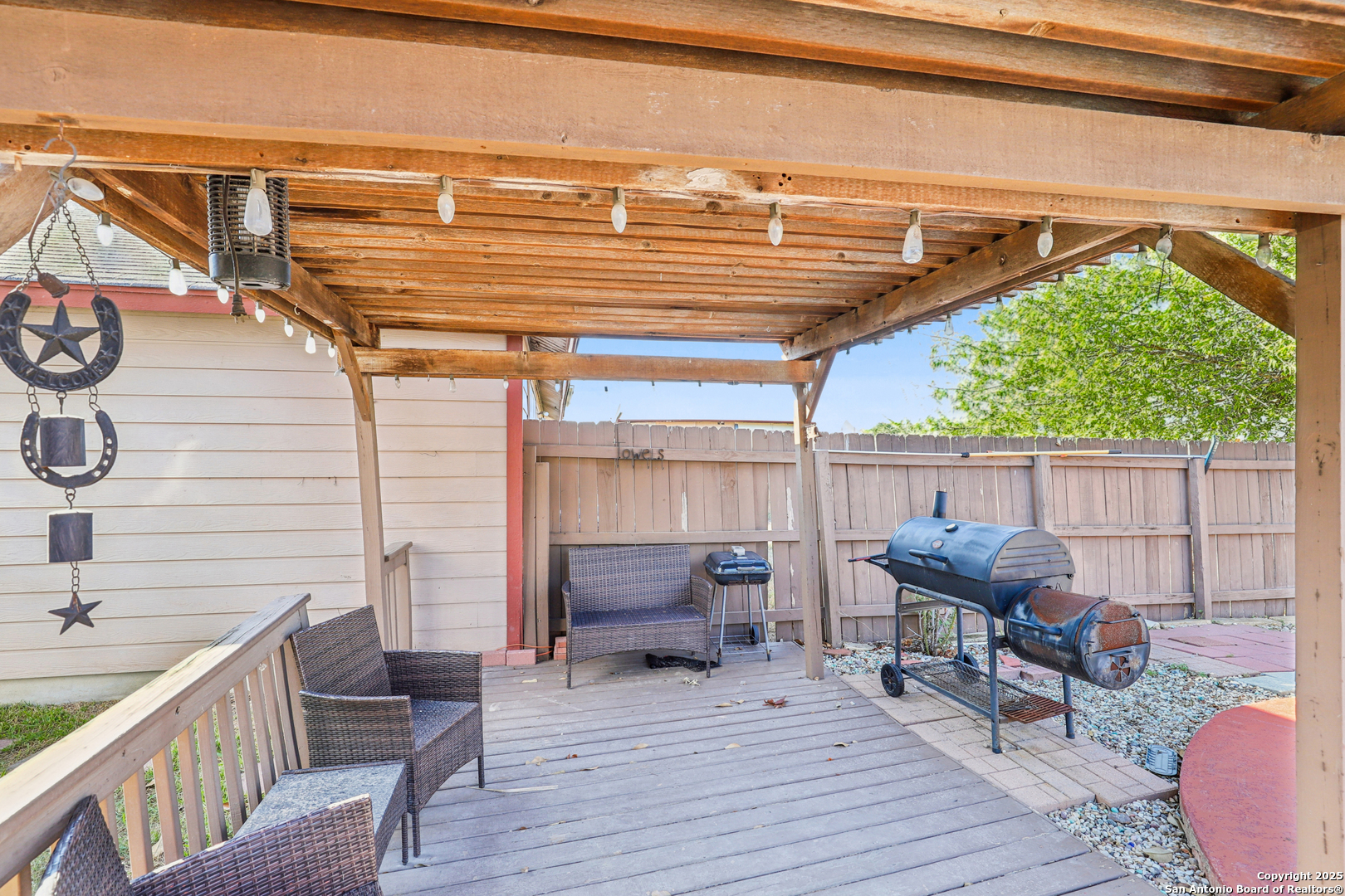 8915 Gathering Pass Converse, TX 78109 - Photo 36 of 37 a balcony with furniture and wooden floor
