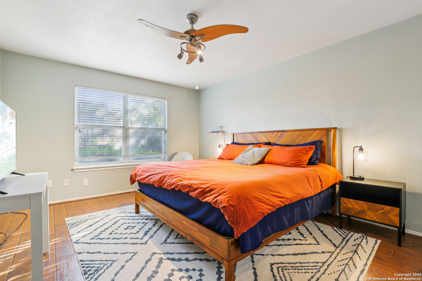 8915 Gathering Pass Converse, TX 78109 - Photo 6 of 37 a bedroom with a bed and a window