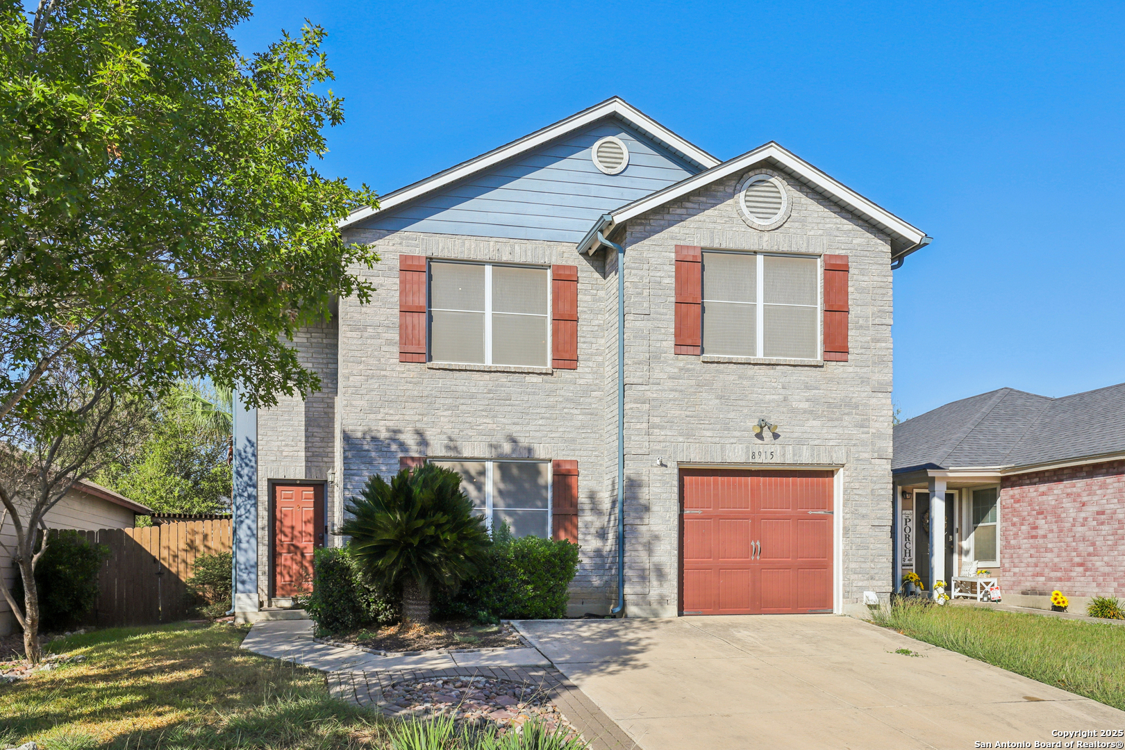 8915 Gathering Pass Converse, TX 78109 - Photo 9 of 37 a front view of a house with a yard