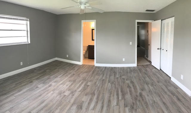 1225 Northwest 21st Street, Unit 912 Stuart, FL 34994 - Photo 13 of 34 Master Bedroom & Bath & Hallway