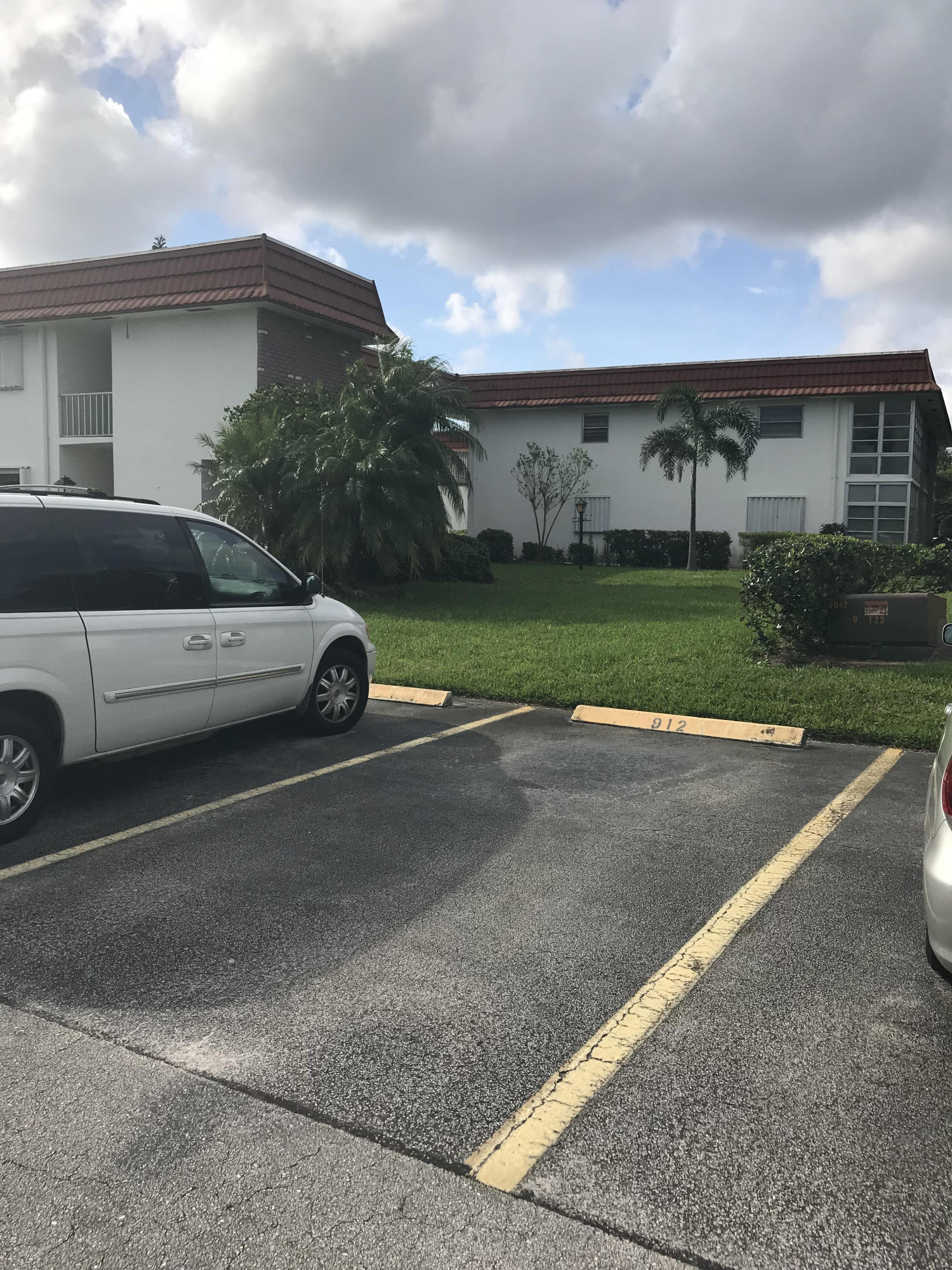 1225 Northwest 21st Street, Unit 912 Stuart, FL 34994 - Photo 2 of 34 Assigned Parking with view of Condo