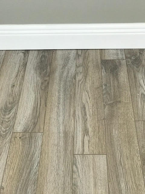 1225 Northwest 21st Street, Unit 912 Stuart, FL 34994 - Photo 21 of 34 Wood Plank Laminate & Shoe Molding