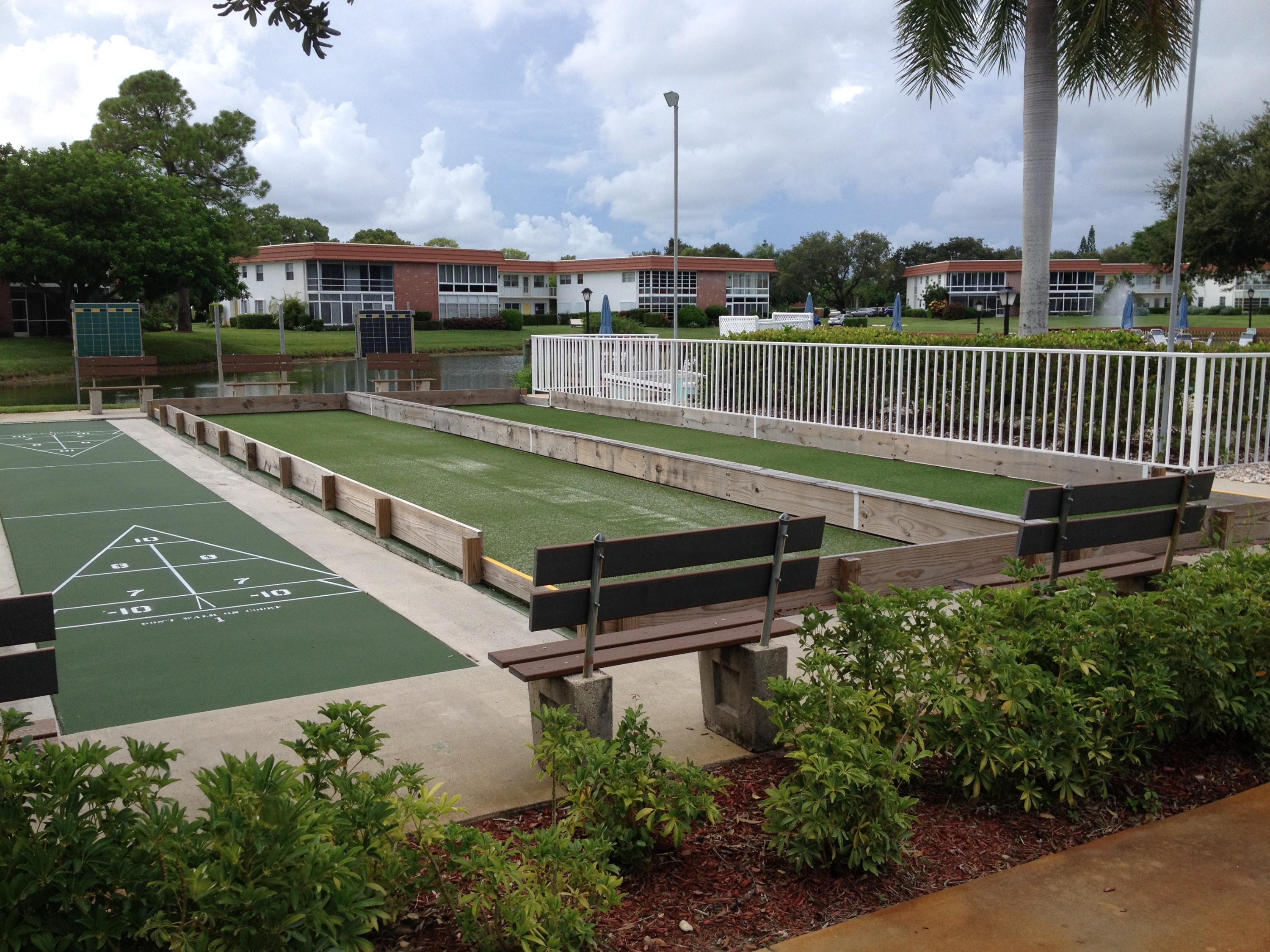 1225 Northwest 21st Street, Unit 912 Stuart, FL 34994 - Photo 29 of 34 Clubhouse Shuffle Board & Bocci Courts