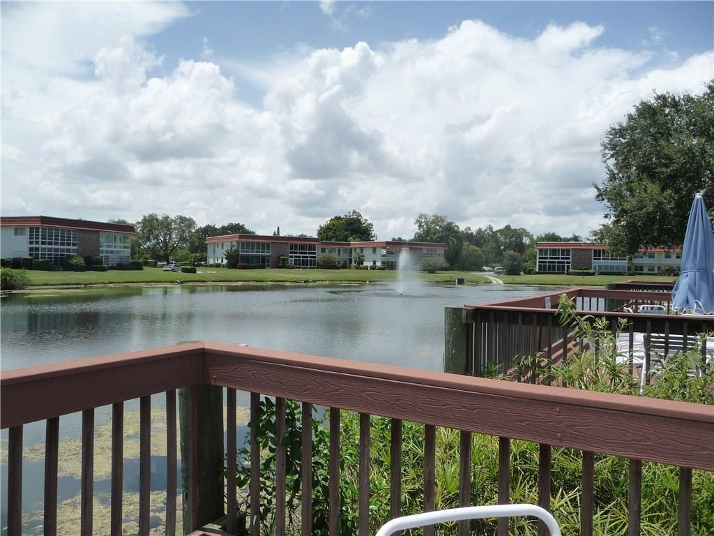 1225 Northwest 21st Street, Unit 912 Stuart, FL 34994 - Photo 30 of 34 Clubhouse Pool Deck Lakeview