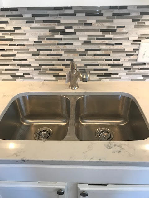 1225 Northwest 21st Street, Unit 912 Stuart, FL 34994 - Photo 9 of 34 Kitchen Backsplash & Sink close-up