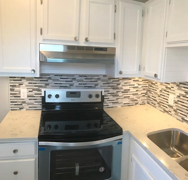 1225 Northwest 21st Street, Unit 912 Stuart, FL 34994 - Photo 10 of 34 Kitchen Stove, Backsplash and Granite cl