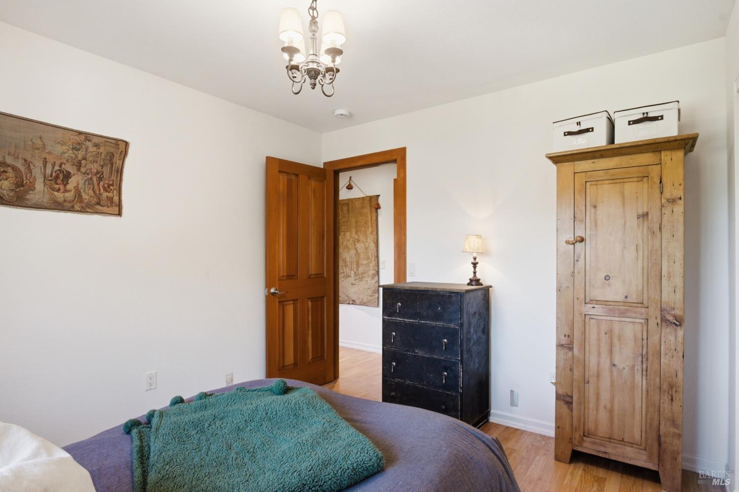 151 High Street Calistoga, CA 94515 - Photo 32 of 52 a bedroom with a bed and a dresser