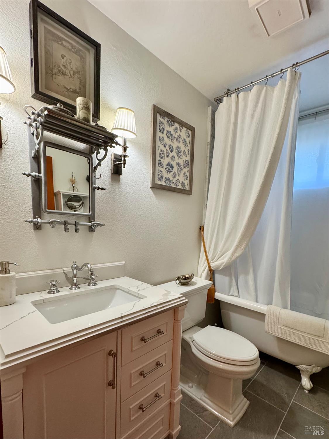 151 High Street Calistoga, CA 94515 - Photo 33 of 52 a bathroom with a sink a toilet and a mirror