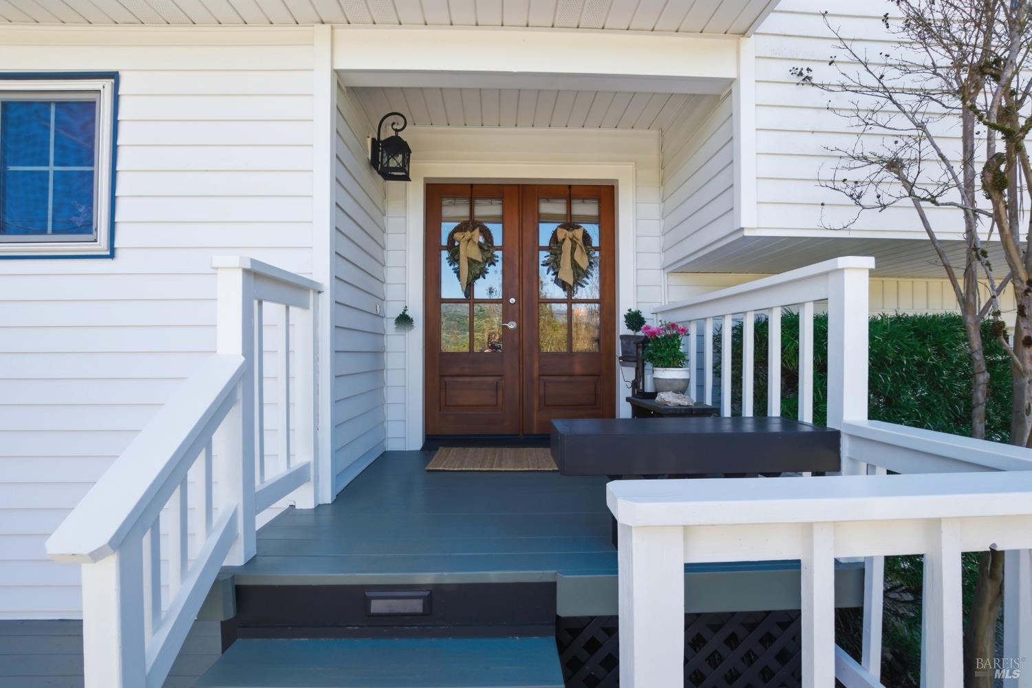 151 High Street Calistoga, CA 94515 - Photo 4 of 52 a view of a patio with table and chairs with wooden floor and fence