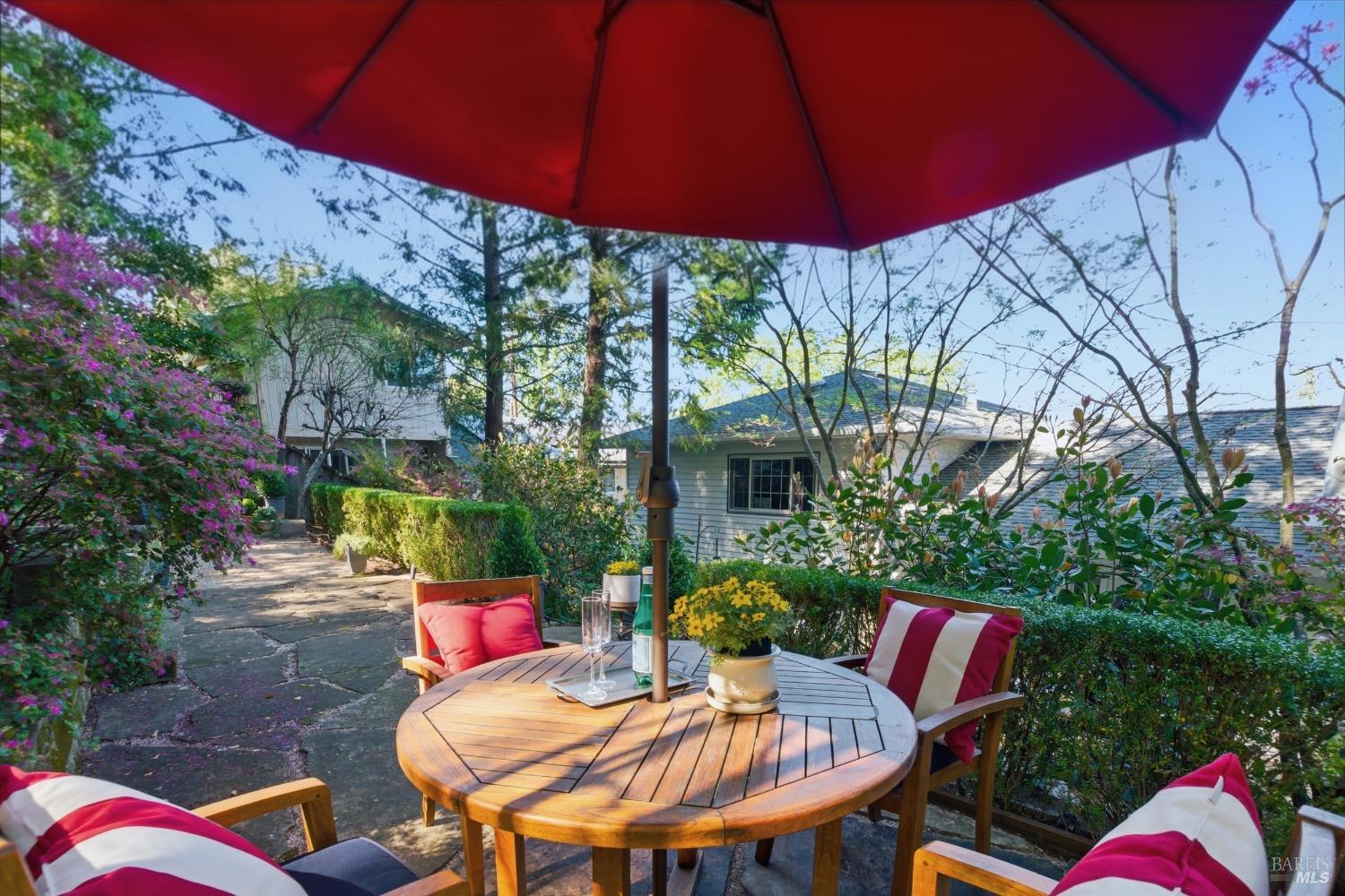 151 High Street Calistoga, CA 94515 - Photo 43 of 52 a view of a chairs and table in backyard