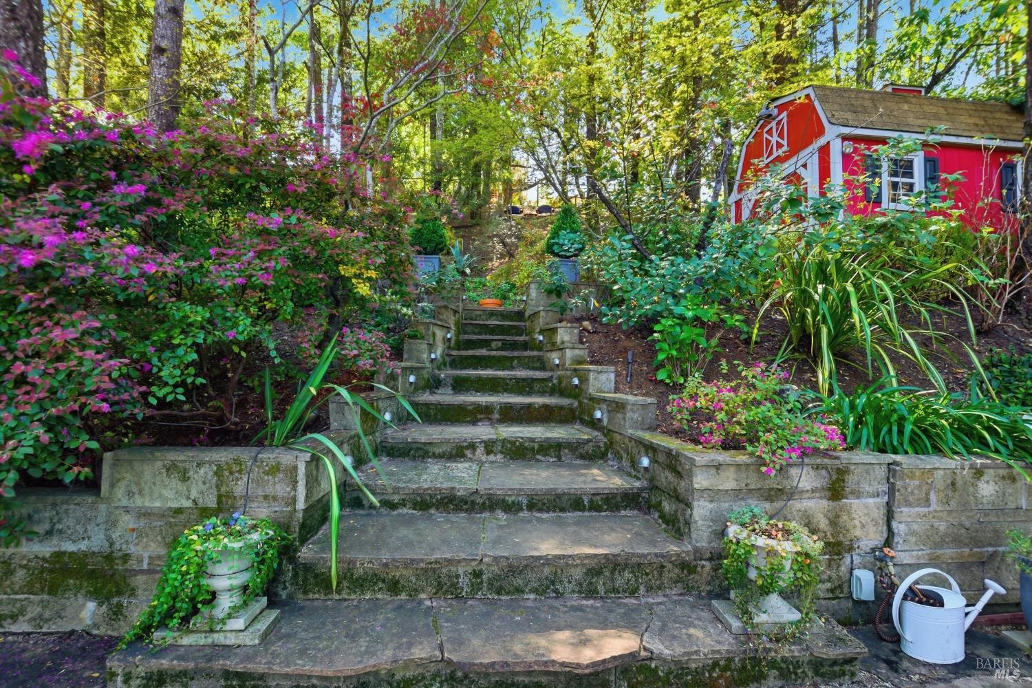 151 High Street Calistoga, CA 94515 - Photo 44 of 52 a front view of multi story residential apartment building with yard and sign board