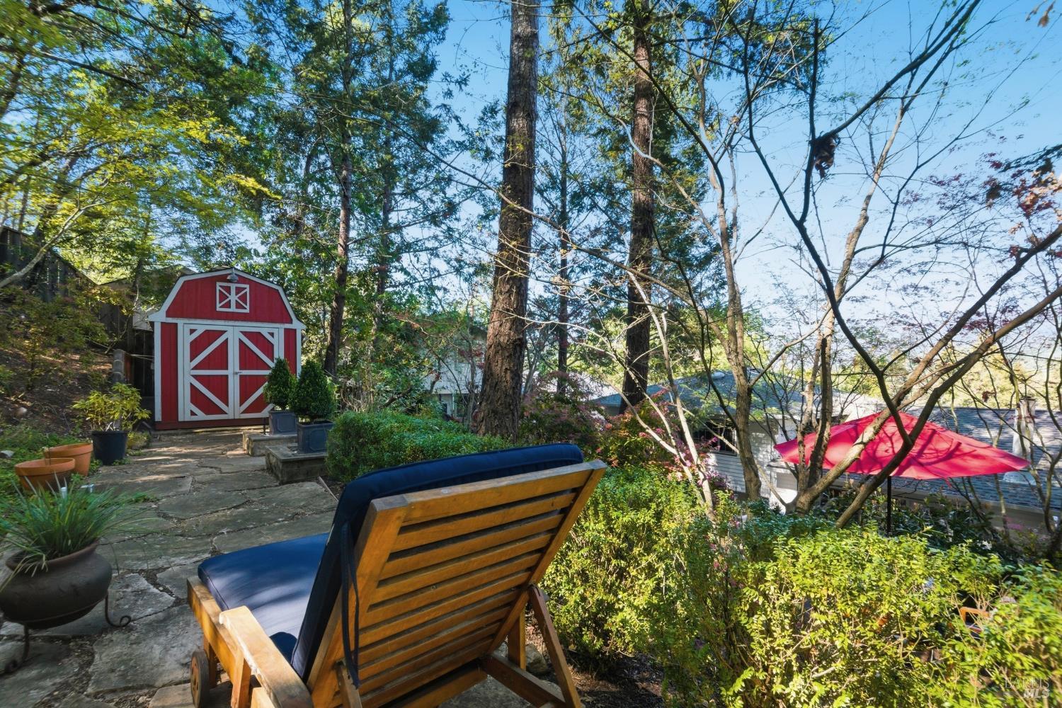 151 High Street Calistoga, CA 94515 - Photo 47 of 52 a sign that is sitting on a wooden bench