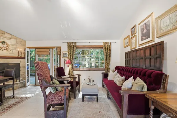 a view of a livingroom with furniture and a fireplace