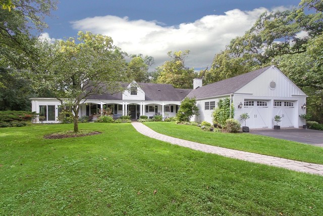 591 Plum Tree Road Barrington Hills, IL 60010 - Photo 1 of 30 a front view of a house with a garden and trees